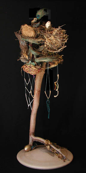 Empty nests in inverted ficus tree, fledglings made of chicken wishbones all symbolizing families in transition